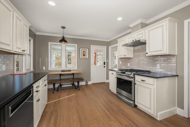 kitchen featuring stainless steel gas range oven, white cabinets, black dishwasher, and tasteful backsplash