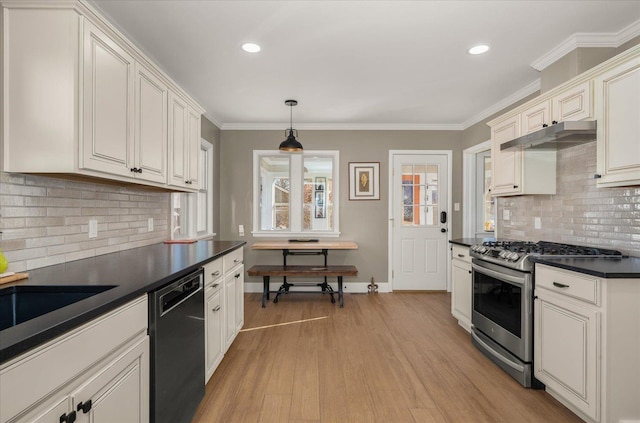 kitchen with light hardwood / wood-style floors, tasteful backsplash, dishwasher, hanging light fixtures, and gas range