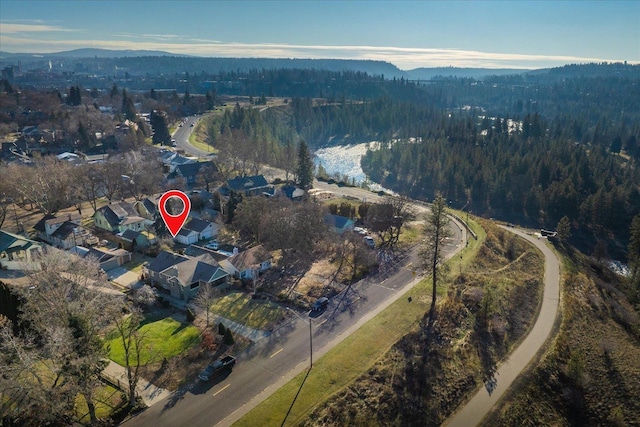 birds eye view of property with a mountain view