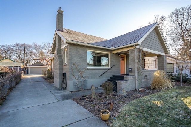 view of front of house featuring an outdoor structure and a garage