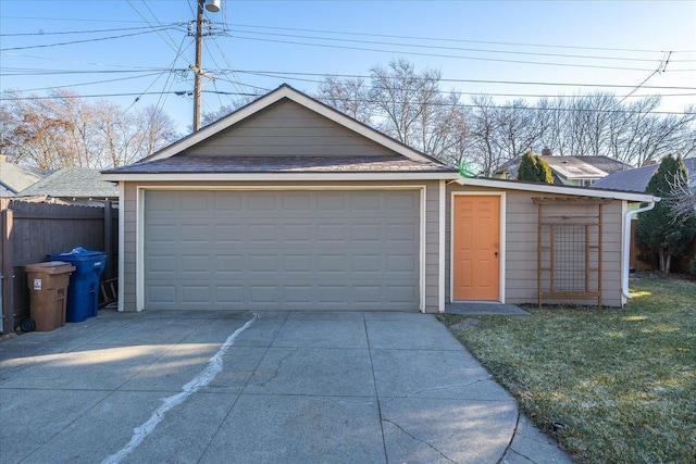 garage featuring a yard