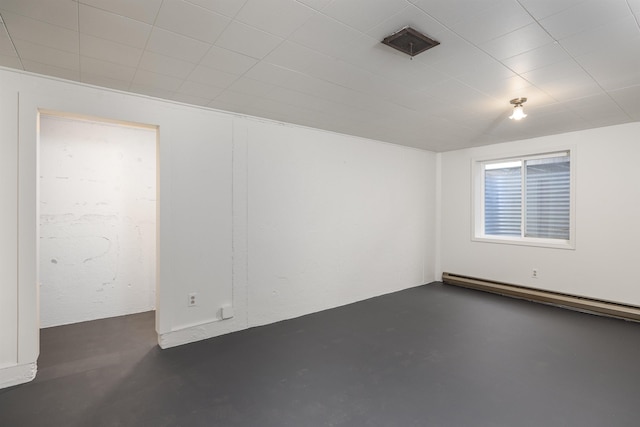 unfurnished room with a baseboard radiator