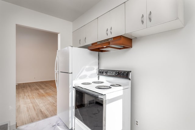 kitchen featuring range hood, white cabinetry, and electric range