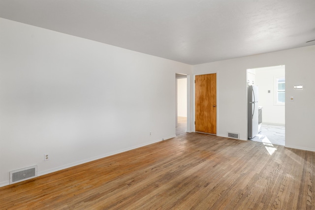 spare room with light wood-type flooring