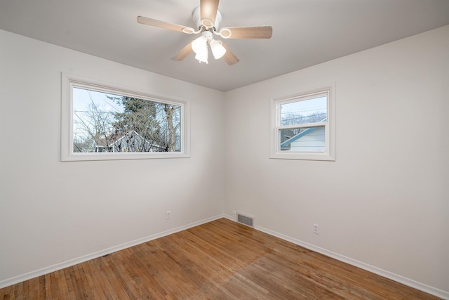 spare room featuring ceiling fan and hardwood / wood-style floors