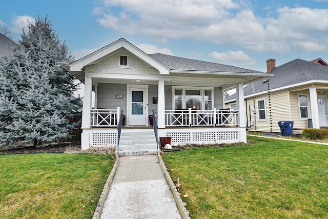 bungalow-style house with a porch and a front lawn