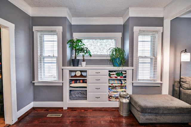 bar featuring plenty of natural light, white cabinetry, dark hardwood / wood-style floors, and ornamental molding