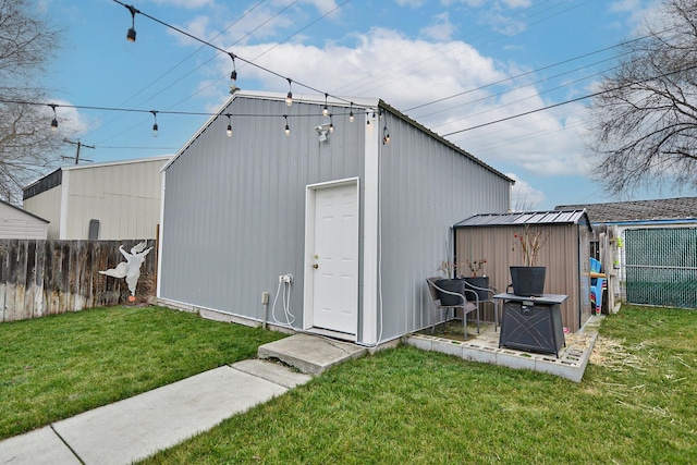 view of outbuilding featuring a yard