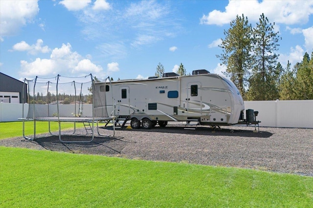 view of yard with a trampoline