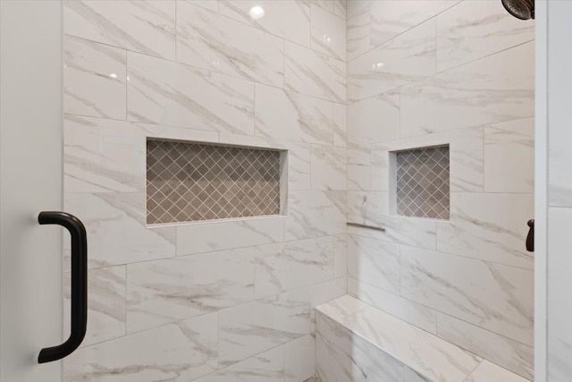 bathroom featuring an enclosed shower