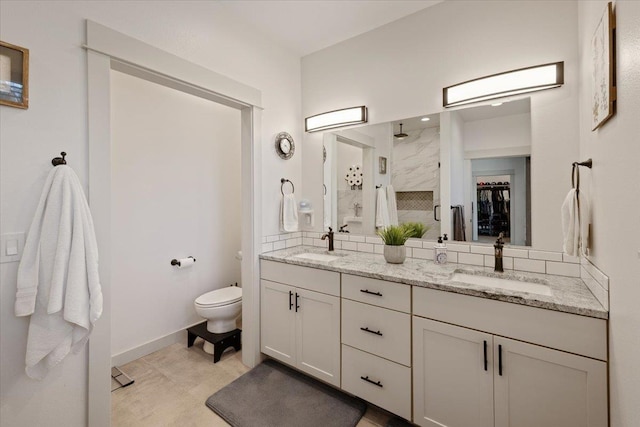 bathroom with walk in shower, vanity, and toilet