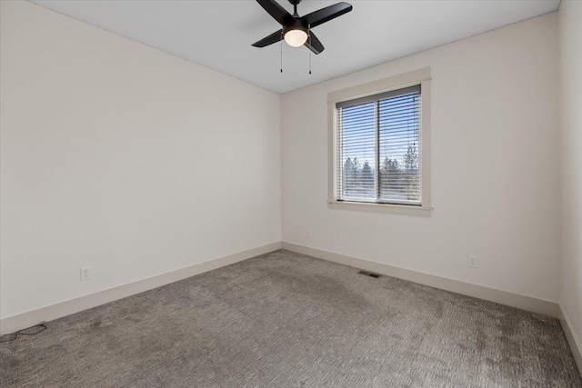 empty room featuring carpet and ceiling fan