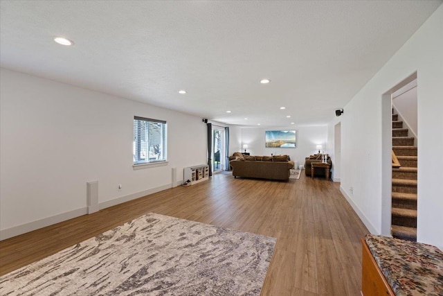 unfurnished living room featuring light wood-type flooring