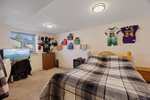 carpeted bedroom with a textured ceiling