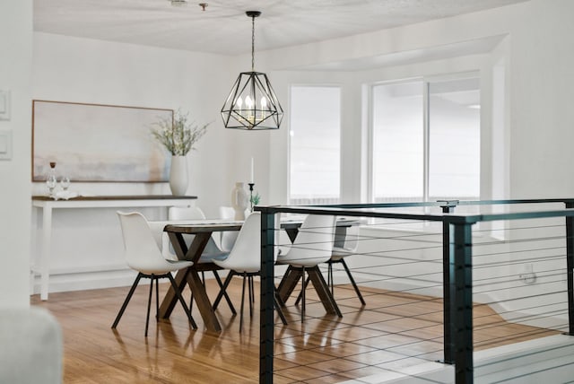 dining area featuring a notable chandelier