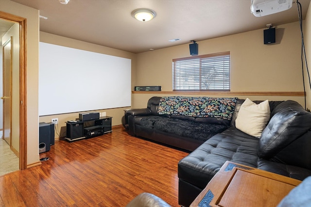 home theater room with hardwood / wood-style floors