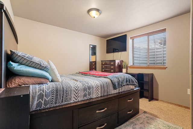 bedroom featuring light carpet