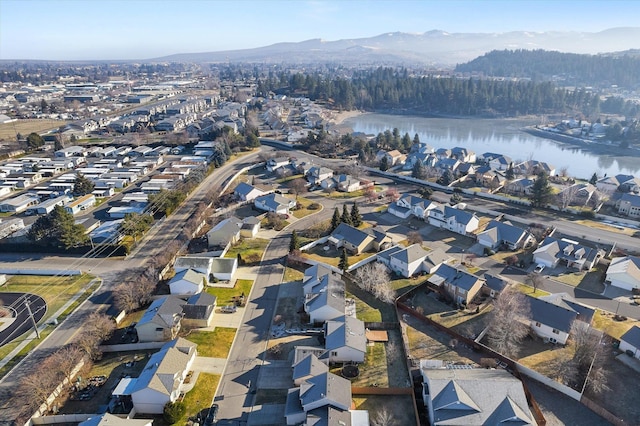 drone / aerial view featuring a water and mountain view