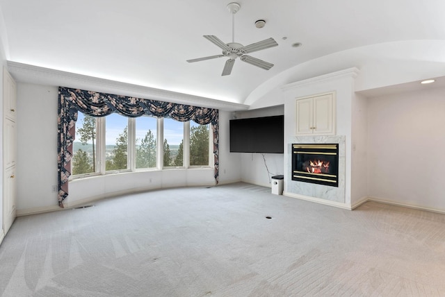 unfurnished living room featuring a fireplace, light colored carpet, brick ceiling, ceiling fan, and lofted ceiling