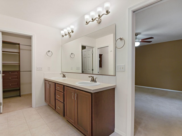 bathroom featuring tile patterned flooring, ceiling fan, and vanity