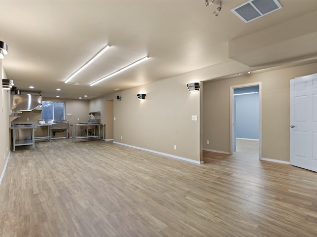 unfurnished living room with light hardwood / wood-style flooring