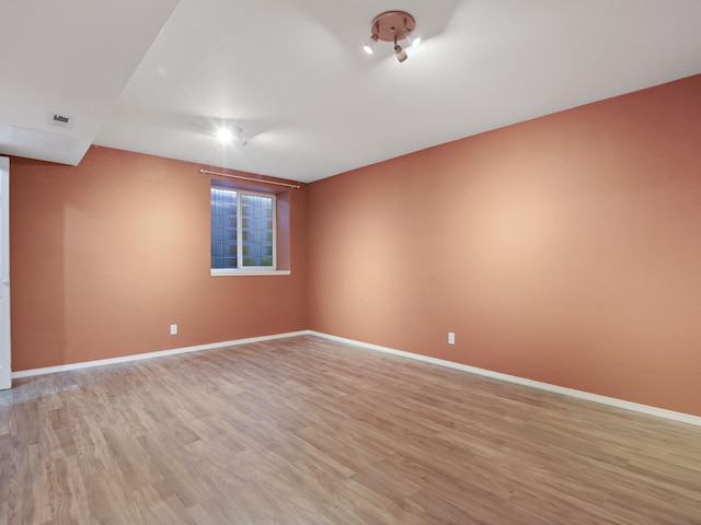 unfurnished room featuring light hardwood / wood-style flooring