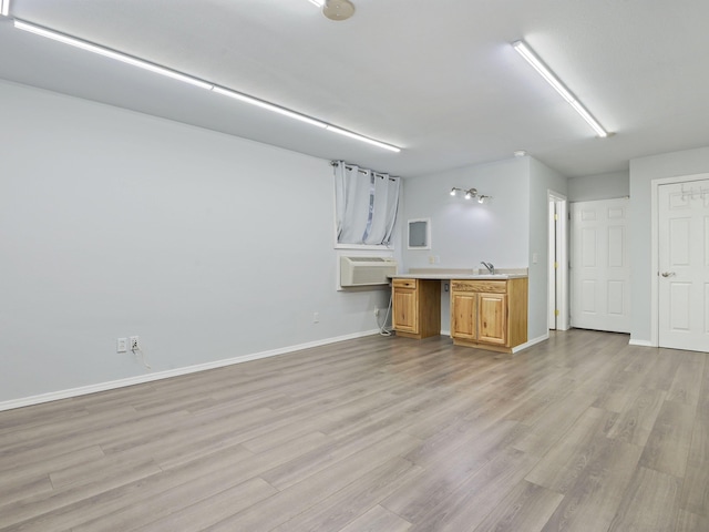 interior space featuring light wood-type flooring and cooling unit