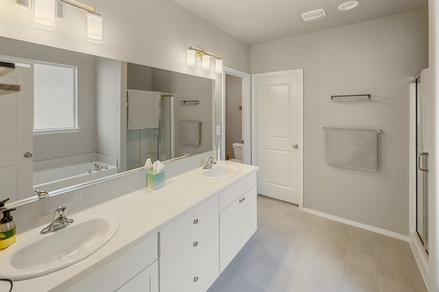 full bathroom with vanity, separate shower and tub, and toilet