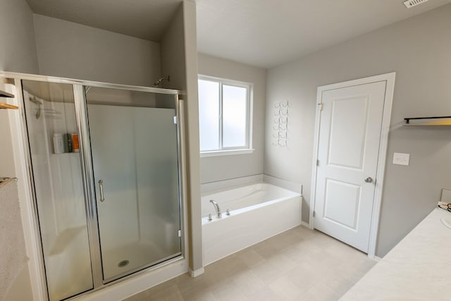 bathroom featuring vanity and shower with separate bathtub