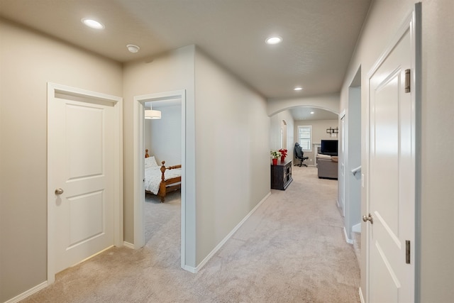 corridor with light colored carpet