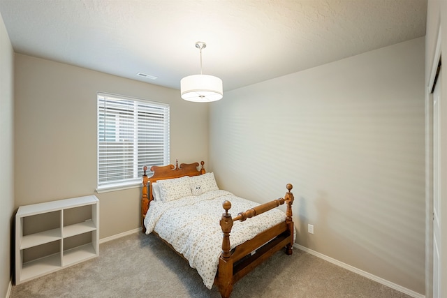 bedroom featuring light colored carpet