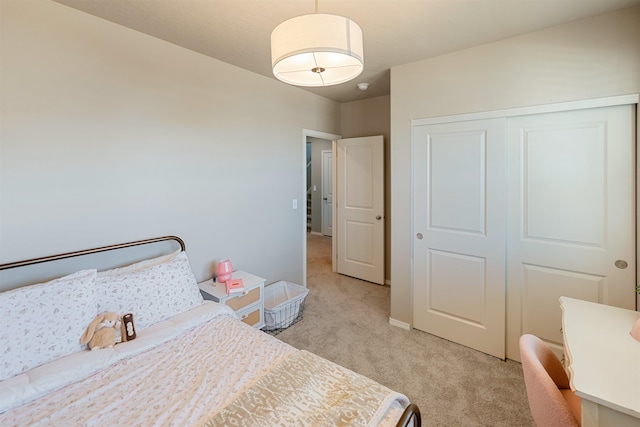 carpeted bedroom featuring a closet