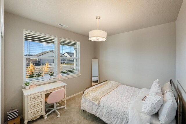 bedroom with light carpet