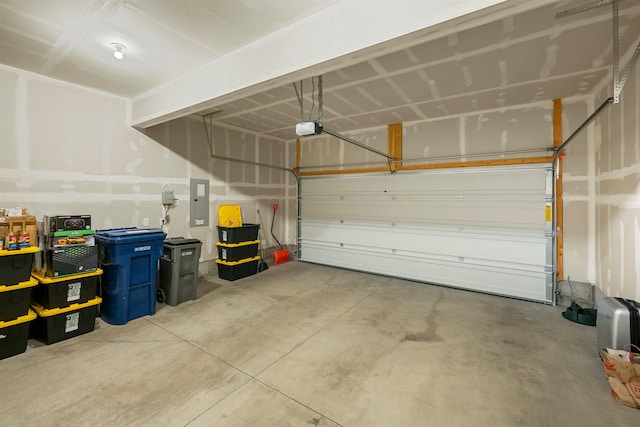 garage featuring a garage door opener and electric panel