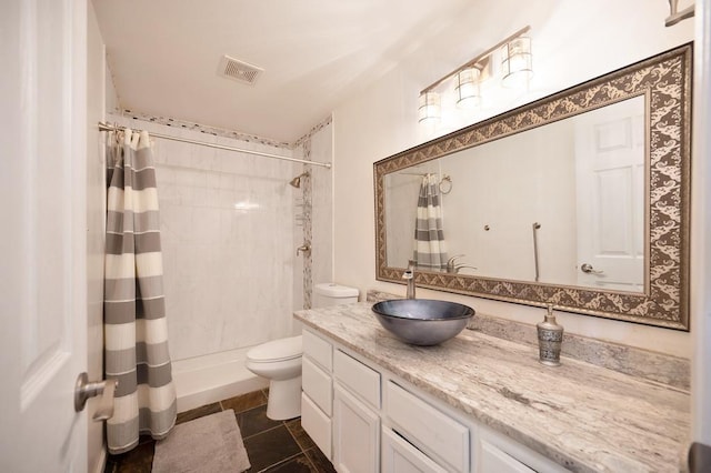 bathroom featuring a shower with curtain, toilet, tile patterned flooring, and vanity