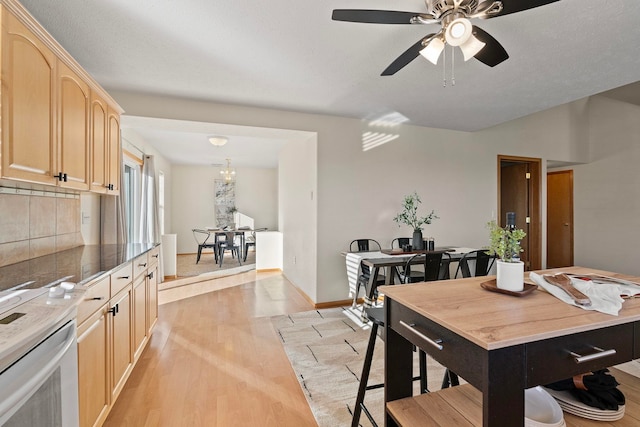 dining area with ceiling fan and light hardwood / wood-style floors