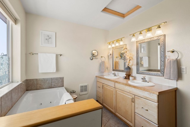 bathroom featuring vanity, a bathtub, and tile patterned floors