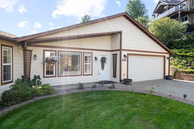 view of front facade with a garage and a front yard