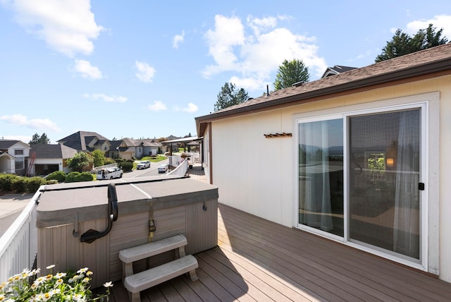 deck featuring a hot tub