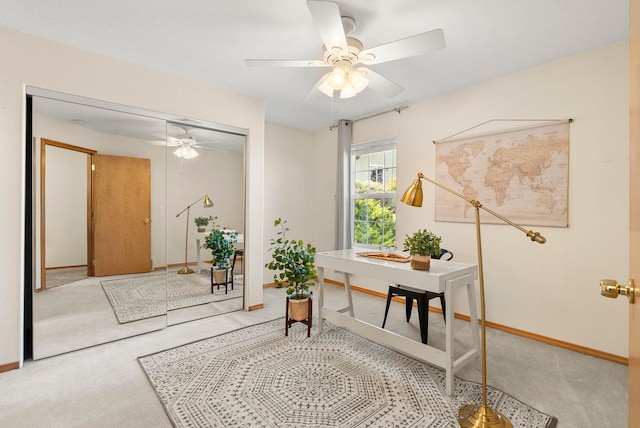 home office featuring ceiling fan and carpet