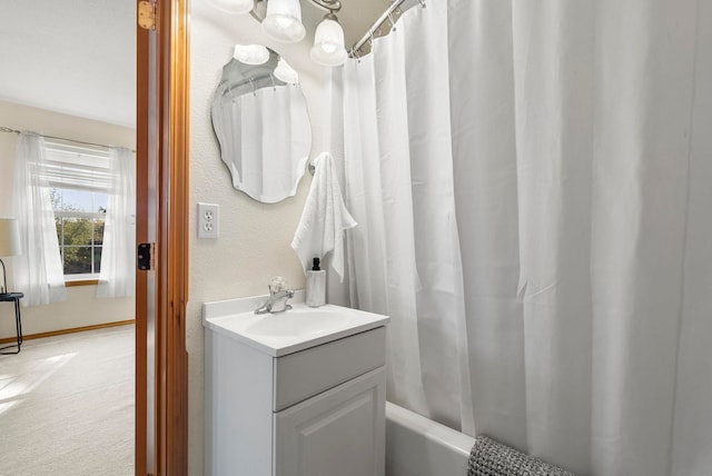 bathroom with shower / tub combo with curtain and vanity