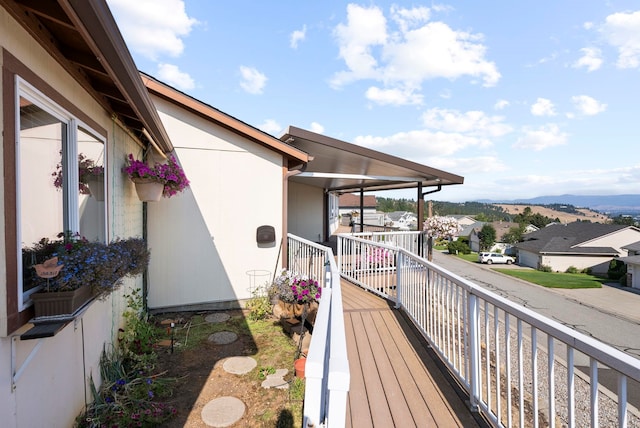 wooden deck with a mountain view