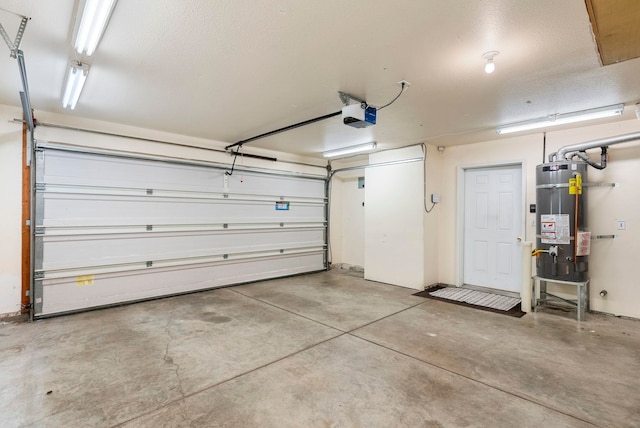 garage featuring water heater and a garage door opener