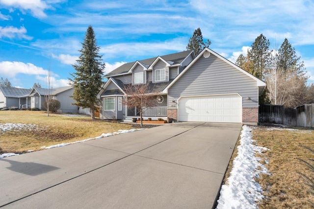 view of front of property with a garage and a front lawn