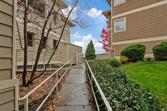 view of side of property with a yard