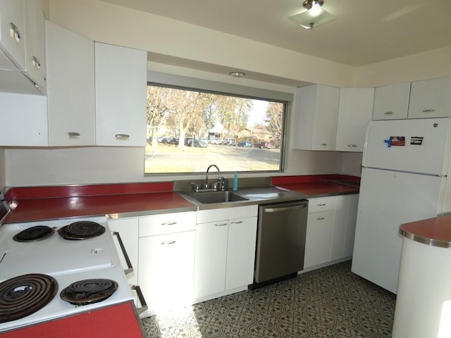 kitchen featuring electric range oven, sink, white cabinets, white refrigerator, and stainless steel dishwasher