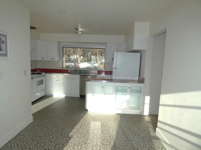 kitchen with white cabinetry, white appliances, and sink