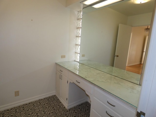 bathroom with vanity and tile patterned flooring