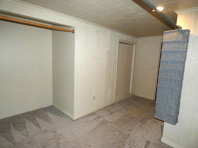 interior space featuring light carpet and crown molding