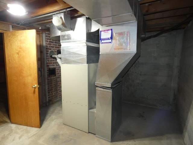 utility room with heating unit